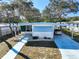 Mobile home exterior, featuring carport and landscaped walkway at 2331 Belleair Rd # 116, Clearwater, FL 33764