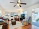 Living room with leather furniture, hardwood floors, and access to porch at 2331 Belleair Rd # 116, Clearwater, FL 33764