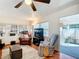 Spacious living room featuring hardwood floors, large TV, and comfortable seating at 2331 Belleair Rd # 116, Clearwater, FL 33764