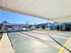 Community shuffleboard courts with covered seating at 2331 Belleair Rd # 116, Clearwater, FL 33764