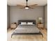 Spacious bedroom with a ceiling fan, wood floors, and bedside tables at 2713 San Luis Rd, Holiday, FL 34691