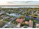 Wide aerial view of waterfront property and neighborhood at 3921 Mimosa Pl, Palm Harbor, FL 34685