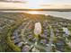 Aerial view of community with lakefront property at 3921 Mimosa Pl, Palm Harbor, FL 34685