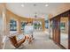 Spacious art studio with large windows, an easel and plenty of natural light at 3921 Mimosa Pl, Palm Harbor, FL 34685
