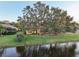 A charming home with a spacious backyard, overlooking a serene lake at 3921 Mimosa Pl, Palm Harbor, FL 34685