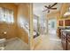 Bathroom with toilet, shower, bathtub and double sinks at 3921 Mimosa Pl, Palm Harbor, FL 34685