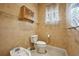 Small bathroom with toilet, bidet and a window at 3921 Mimosa Pl, Palm Harbor, FL 34685