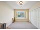 Spacious bedroom with window seat and a large closet at 3921 Mimosa Pl, Palm Harbor, FL 34685