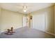 Well-lit bedroom, featuring a ceiling fan and double closet at 3921 Mimosa Pl, Palm Harbor, FL 34685