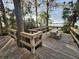 Wooden deck overlooking a tranquil lake view at 3921 Mimosa Pl, Palm Harbor, FL 34685