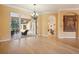 Elegant dining room with hardwood floors and access to the patio at 3921 Mimosa Pl, Palm Harbor, FL 34685