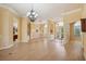 Bright dining room with hardwood floors, chandelier, and access to backyard at 3921 Mimosa Pl, Palm Harbor, FL 34685
