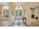 Bright and spacious entryway with hardwood floors and French doors at 3921 Mimosa Pl, Palm Harbor, FL 34685