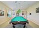 Game room featuring a pool table, wall art, and ample space for entertainment at 3921 Mimosa Pl, Palm Harbor, FL 34685