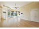 Spacious Gathering room with hardwood floors and access to the pool at 3921 Mimosa Pl, Palm Harbor, FL 34685