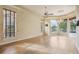 Sun-drenched Gathering room with hardwood floors and pool views at 3921 Mimosa Pl, Palm Harbor, FL 34685