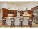 Large kitchen island with granite countertop and breakfast bar at 3921 Mimosa Pl, Palm Harbor, FL 34685