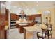 Spacious kitchen with island, granite counters, and stainless steel appliances at 3921 Mimosa Pl, Palm Harbor, FL 34685