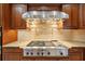 Stainless steel range and hood are the centerpiece of this stunning kitchen at 3921 Mimosa Pl, Palm Harbor, FL 34685