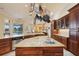 Gourmet kitchen boasts granite countertops, stainless steel appliances, and ample cabinetry at 3921 Mimosa Pl, Palm Harbor, FL 34685