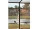 Two deer by a lake fountain, seen from screened enclosure at 3921 Mimosa Pl, Palm Harbor, FL 34685
