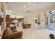 Spacious living room with hardwood floors and access to the backyard patio at 3921 Mimosa Pl, Palm Harbor, FL 34685