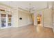 Spacious living room with hardwood floors, high ceilings, and a view to the kitchen at 3921 Mimosa Pl, Palm Harbor, FL 34685