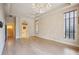 Luxurious main bedroom with hardwood floors and chandelier at 3921 Mimosa Pl, Palm Harbor, FL 34685