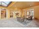 Relaxing patio with seating area, overlooking the pool and kitchen at 3921 Mimosa Pl, Palm Harbor, FL 34685