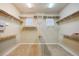 Large walk-in closet with ample shelving at 3921 Mimosa Pl, Palm Harbor, FL 34685