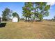 Large backyard with shed and open field at 5592 Fairway Dr, Ridge Manor, FL 33523