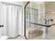 Clean bathroom with walk-in shower and tile surround at 5592 Fairway Dr, Ridge Manor, FL 33523
