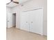 Bedroom with tile floors and a large closet at 5592 Fairway Dr, Ridge Manor, FL 33523