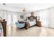 Spacious Primary bedroom with wood furniture and tile flooring at 5592 Fairway Dr, Ridge Manor, FL 33523