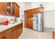 Spacious kitchen with wood cabinets and granite countertops at 5592 Fairway Dr, Ridge Manor, FL 33523