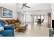 Open living room with high ceilings and adjacent dining area at 5592 Fairway Dr, Ridge Manor, FL 33523