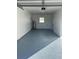 Spacious garage with freshly painted floor and ample storage at 7222 Riverwood Blvd, Tampa, FL 33615