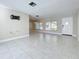 Bright and airy living room with tile floors and plenty of natural light at 908 Normandy Rd, Clearwater, FL 33764