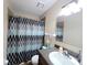 Clean bathroom with shower/tub combo and vanity at 2302 Maki Rd # 5, Plant City, FL 33563