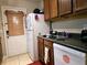 Kitchen with wood cabinets, sink, and dishwasher at 2302 Maki Rd # 5, Plant City, FL 33563