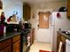 Kitchen with appliances and wood cabinets at 2302 Maki Rd # 5, Plant City, FL 33563