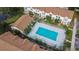 Community pool with surrounding buildings and landscaping at 2302 Maki Rd # 5, Plant City, FL 33563