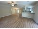 Bright living room featuring hardwood floors and a ceiling fan at 10040 Jungle St, New Port Richey, FL 34654