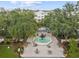 Aerial view of a park with a fountain and trees in an urban environment at 102 S Moody Ave # 3, Tampa, FL 33609
