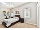 Spacious bedroom with ceiling fan, wood bed frame and large windows at 102 S Moody Ave # 3, Tampa, FL 33609
