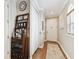 Bright entryway with hardwood floors, a wine rack, and coat closet at 102 S Moody Ave # 3, Tampa, FL 33609