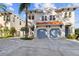 Elegant two-story home with a two-car garage, featuring a well-manicured lawn and lovely tropical landscaping at 102 S Moody Ave # 3, Tampa, FL 33609