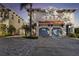 Elegant two-story home with a two-car garage, featuring a well-manicured lawn and lovely tropical landscaping at 102 S Moody Ave # 3, Tampa, FL 33609