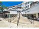 Exterior view of retail building with large staircase in a shopping district at 102 S Moody Ave # 3, Tampa, FL 33609