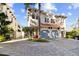 Elegant two-story home with a two-car garage, featuring a well-manicured lawn and lovely tropical landscaping at 102 S Moody Ave # 3, Tampa, FL 33609